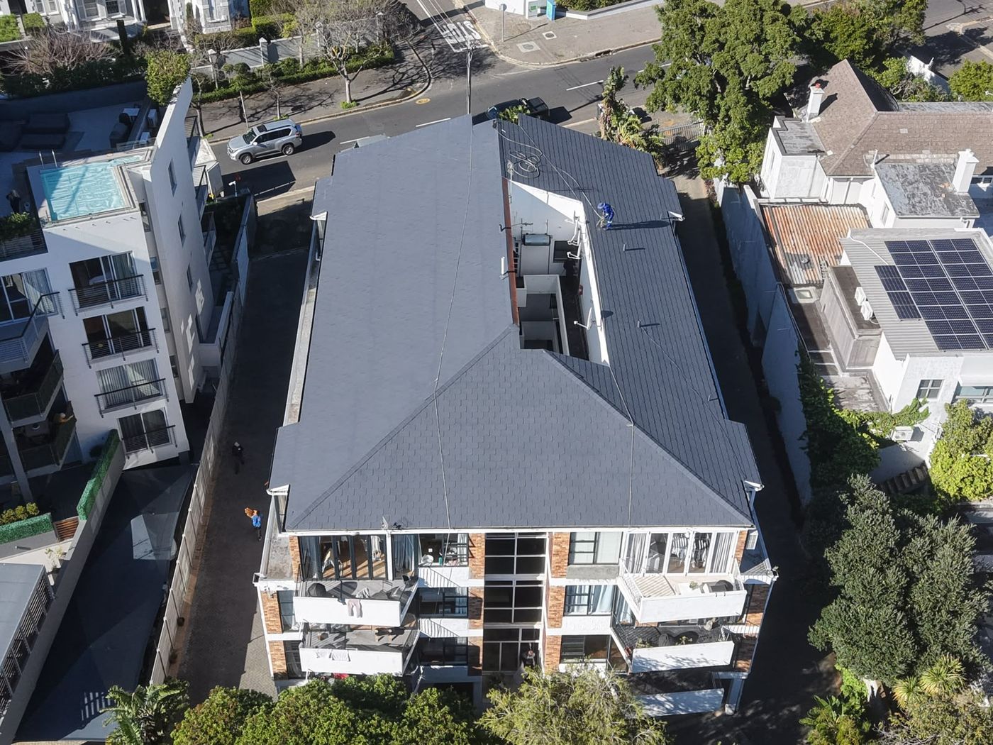 Block of flats with its roof sealed in charcoal